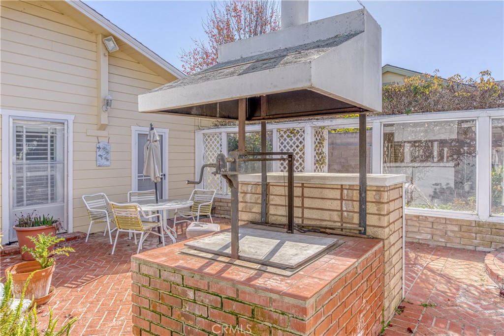 150 Pinal Avenue Santa Maria, CA 93455 - Photo 33 of 36 a roof deck with table and chairs under an umbrella