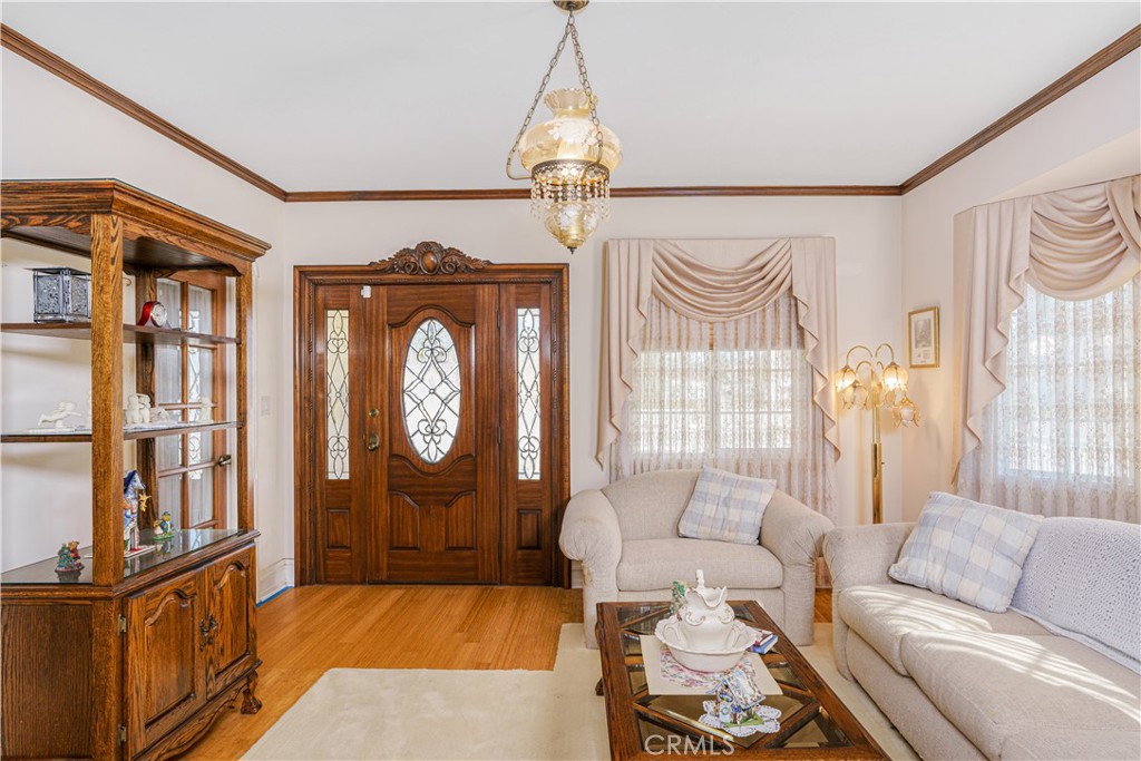 150 Pinal Avenue Santa Maria, CA 93455 - Photo 10 of 36 a living room with furniture a chandelier and a window