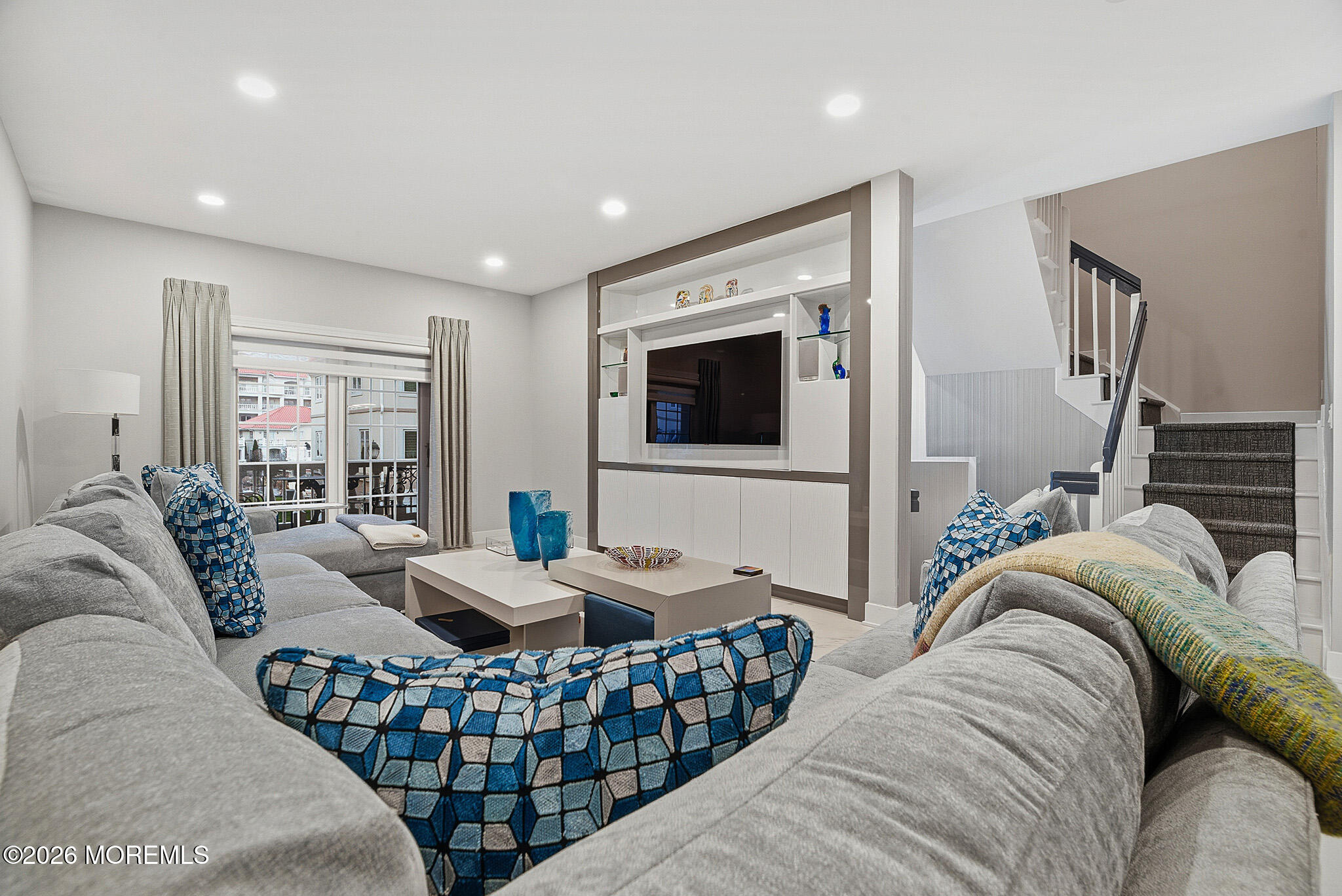 17 Riviera Drive Long Branch, NJ 07740 - Photo 13 of 46 a living room with furniture and a flat screen tv