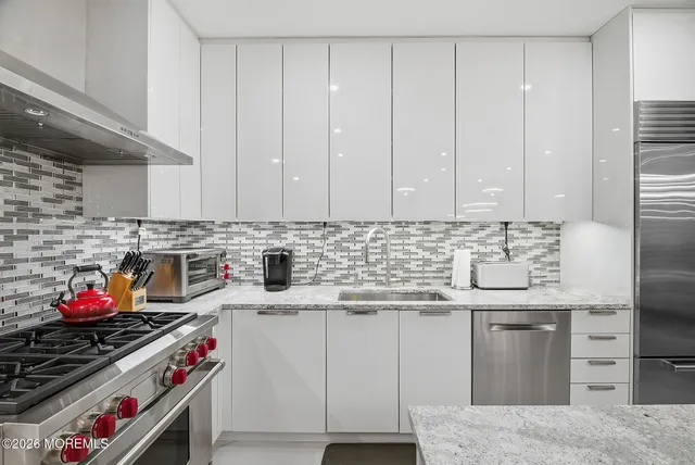 a kitchen with a stove and a microwave