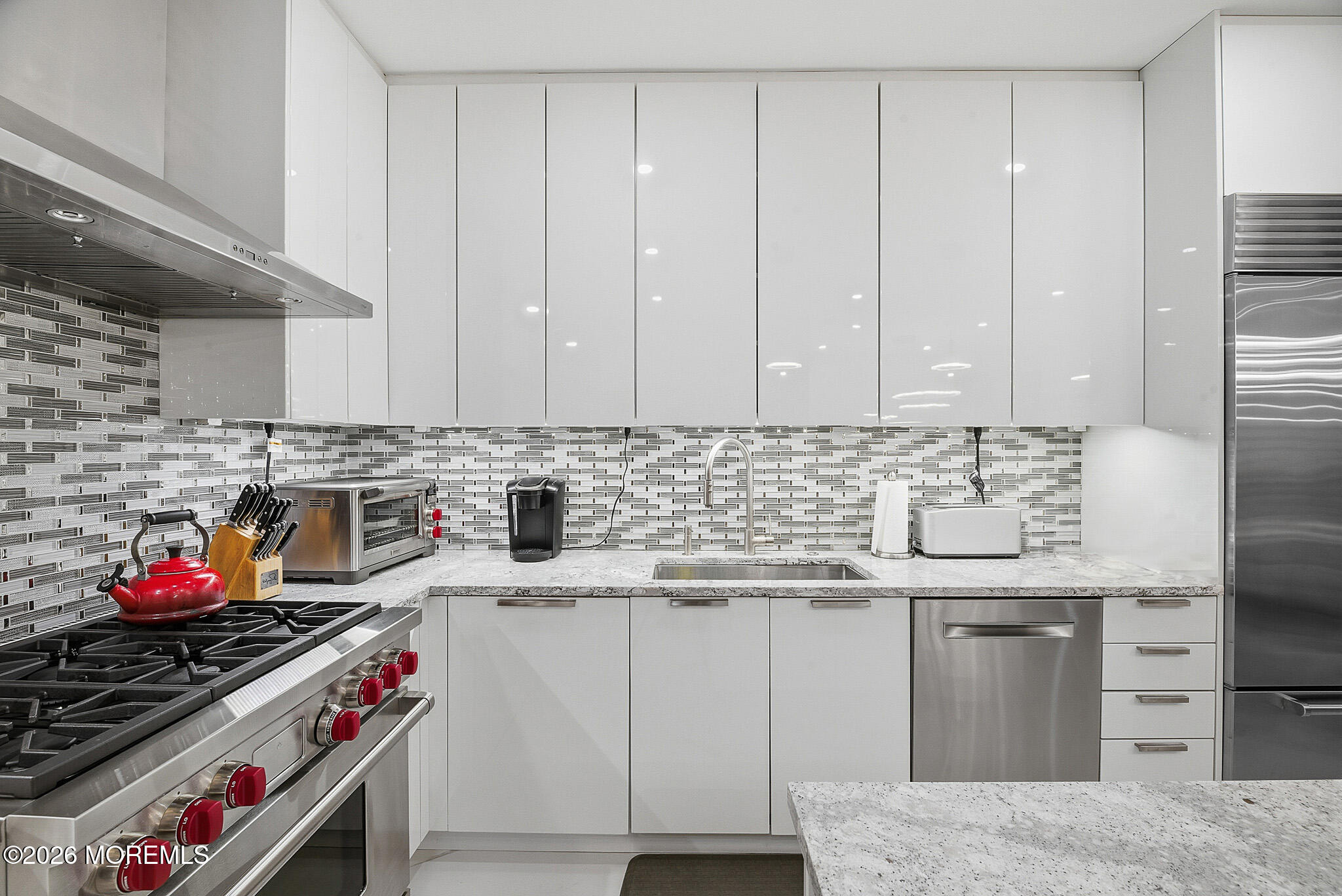 17 Riviera Drive Long Branch, NJ 07740 - Photo 22 of 46 a kitchen with stainless steel appliances granite countertop a sink stove and cabinets