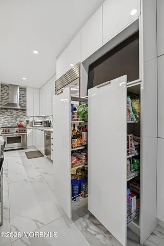 a bathroom with a sink toilet and mirror