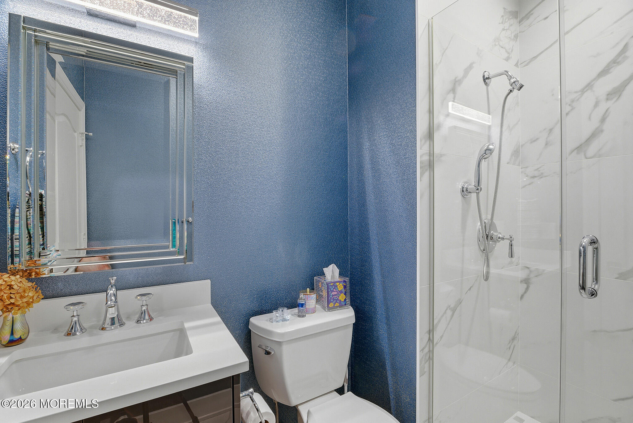 17 Riviera Drive Long Branch, NJ 07740 - Photo 27 of 46 a bathroom with a sink toilet and mirror