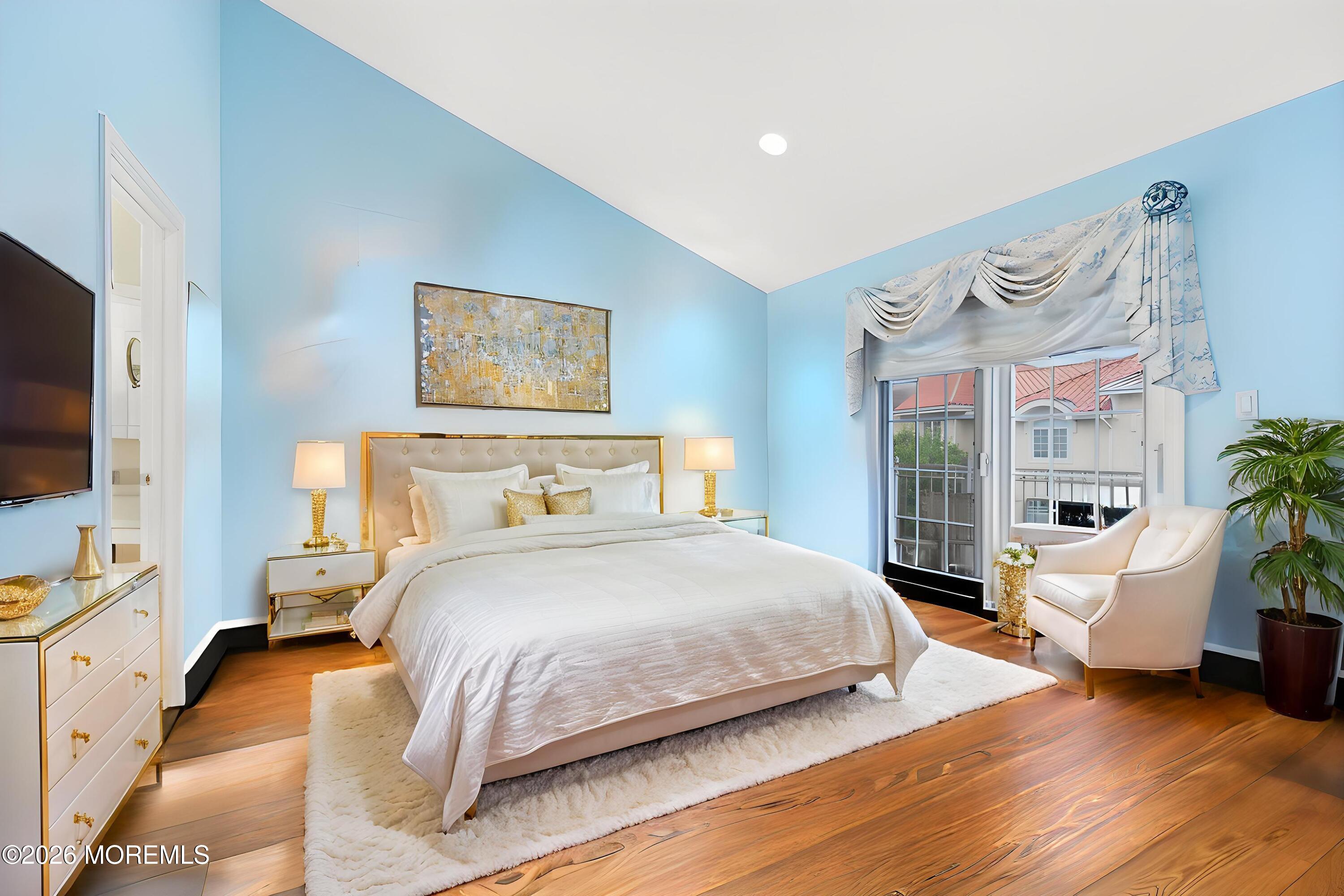 17 Riviera Drive Long Branch, NJ 07740 - Photo 29 of 46 a bedroom with bed and a flat screen tv