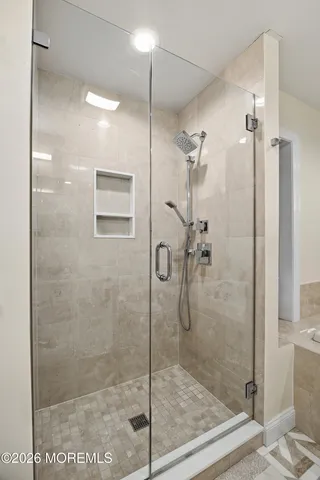 a bedroom with bed and a couch