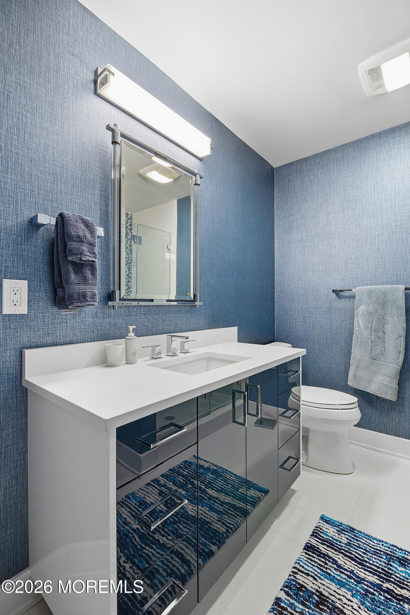 17 Riviera Drive Long Branch, NJ 07740 - Photo 36 of 46 a bathroom with a sink a toilet and mirror