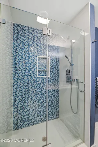 a bathroom with a sink a toilet and shower curtain