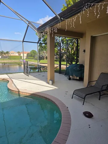 a bed sitting in a spacious bedroom next to a window
