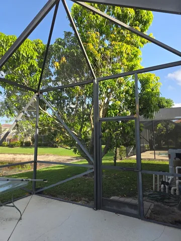 a bed sitting in a bedroom next to a lamp