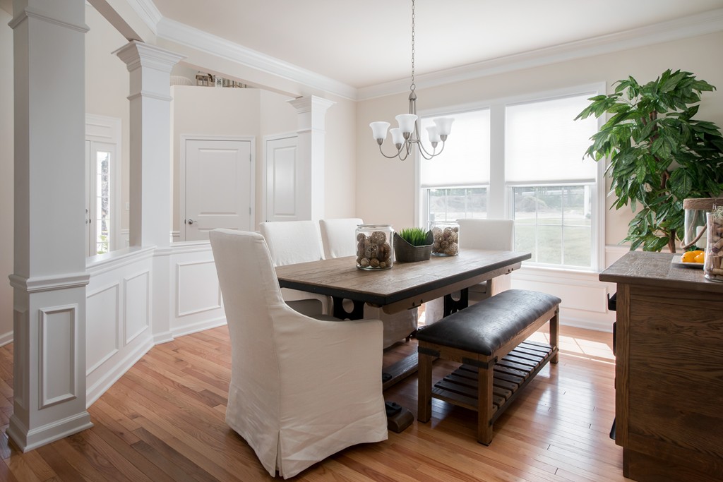 81 Monroe Drive, Unit 16 Holliston, MA 01746 - Photo 11 of 30 a view of a dining room with furniture window and wooden floor