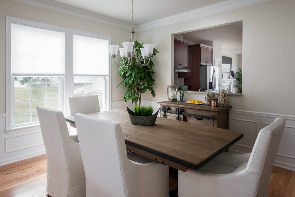 81 Monroe Drive, Unit 16 Holliston, MA 01746 - Photo 12 of 30 a view of a dining room with furniture window and outside view