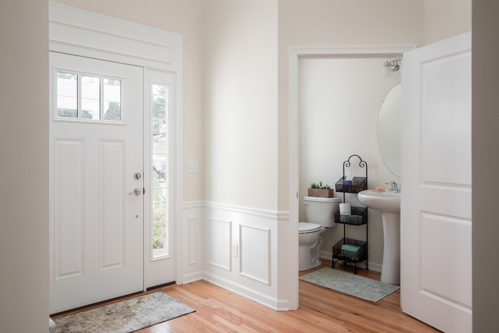 81 Monroe Drive, Unit 16 Holliston, MA 01746 - Photo 7 of 30 a room that has a bed and a window in it