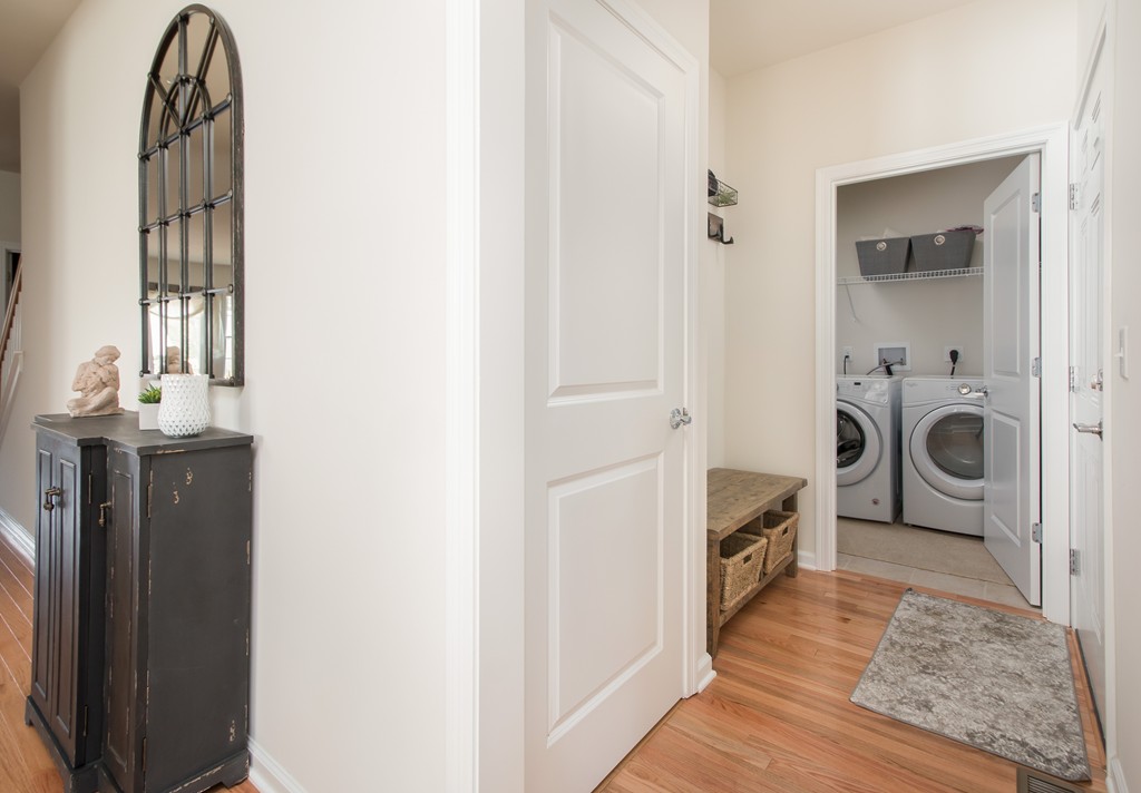 81 Monroe Drive, Unit 16 Holliston, MA 01746 - Photo 9 of 30 a view of a bedroom with washer and dryer