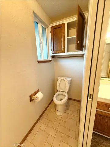 an empty room with windows and entrance