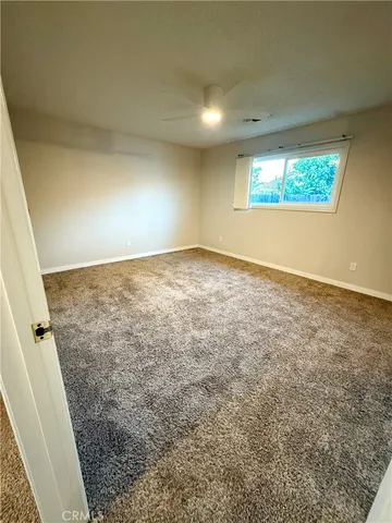 walk in closet with wooden floor