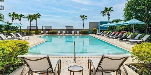 a view of a chairs and table in patio