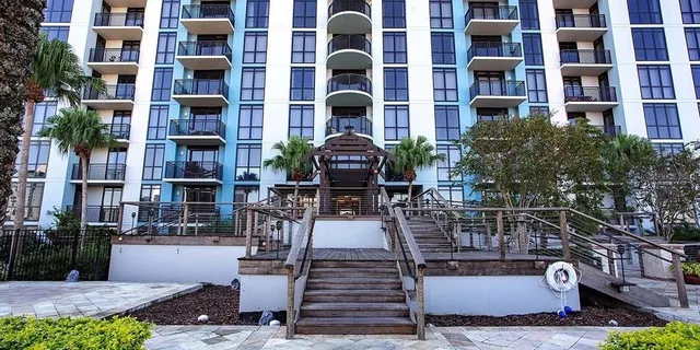 a front view of building with yard