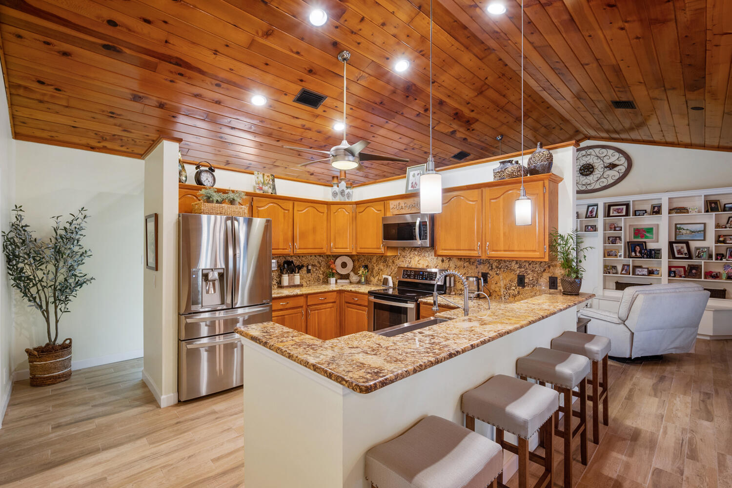 16219 134th Terrace North Jupiter, FL 33478 - Photo 11 of 40 a kitchen with granite countertop lots of counter top space and stainless steel appliances