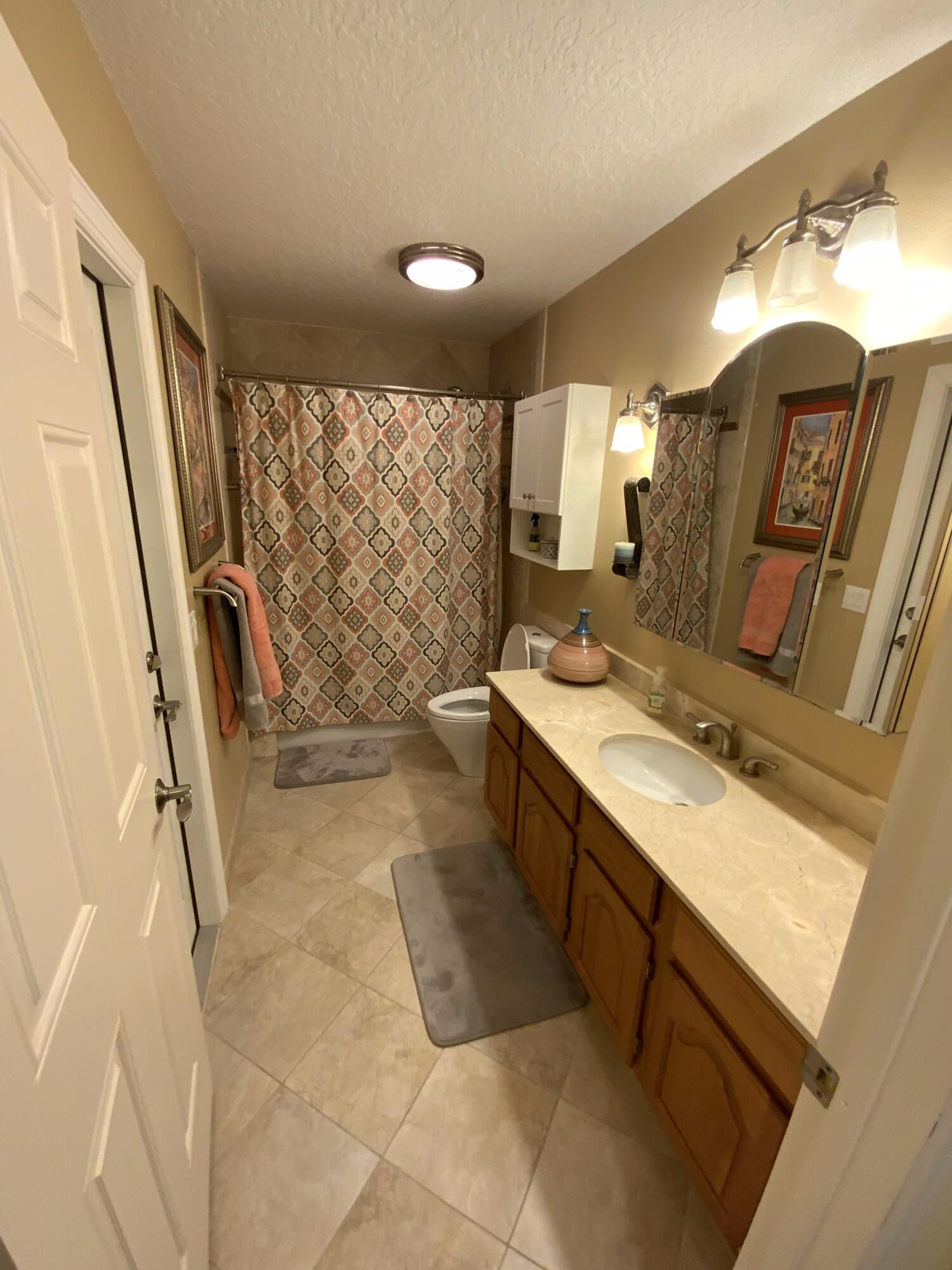 16219 134th Terrace North Jupiter, FL 33478 - Photo 18 of 40 a bathroom with double vanity and a mirror