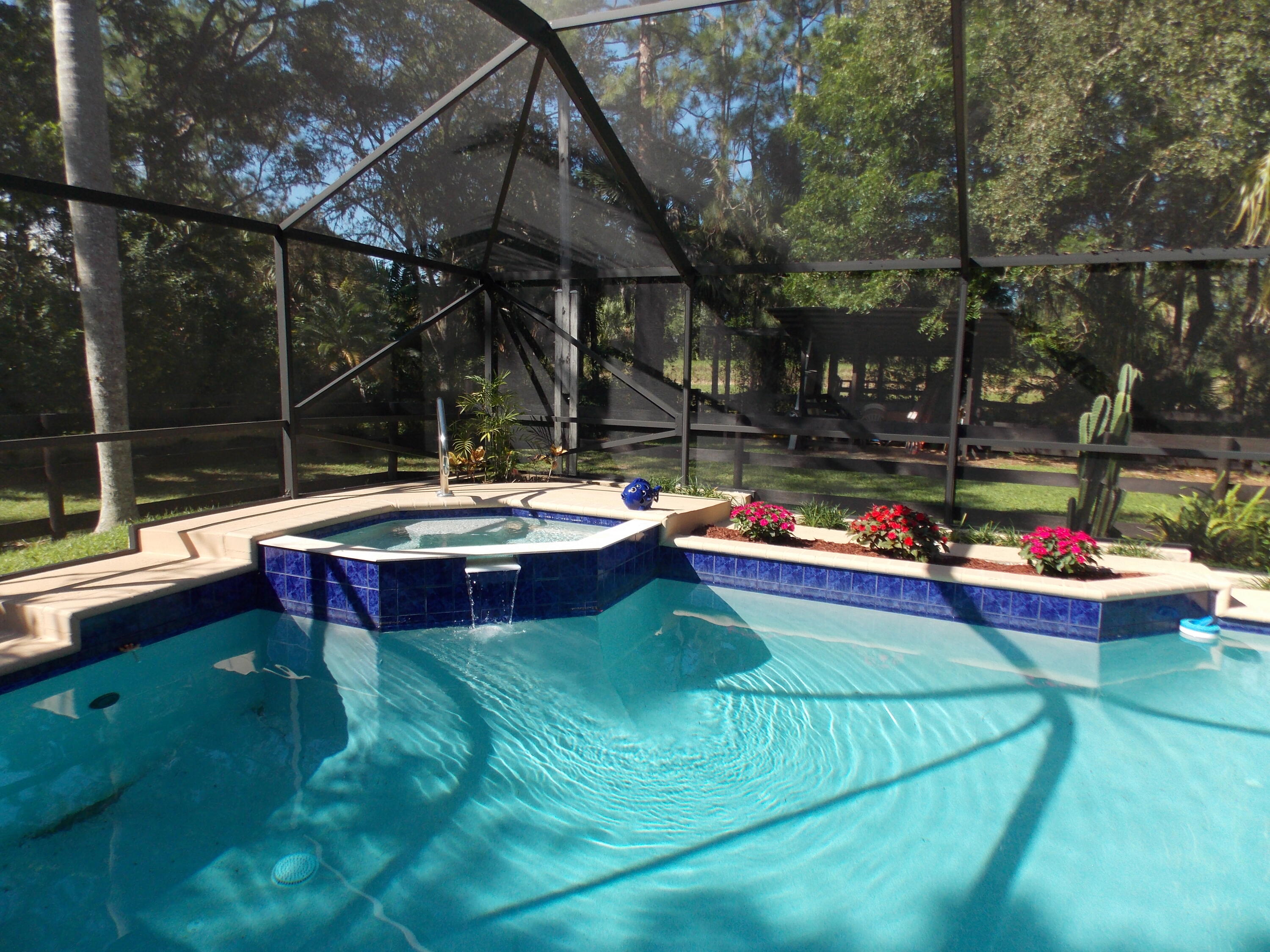 16219 134th Terrace North Jupiter, FL 33478 - Photo 28 of 40 a view of a swimming pool with a patio
