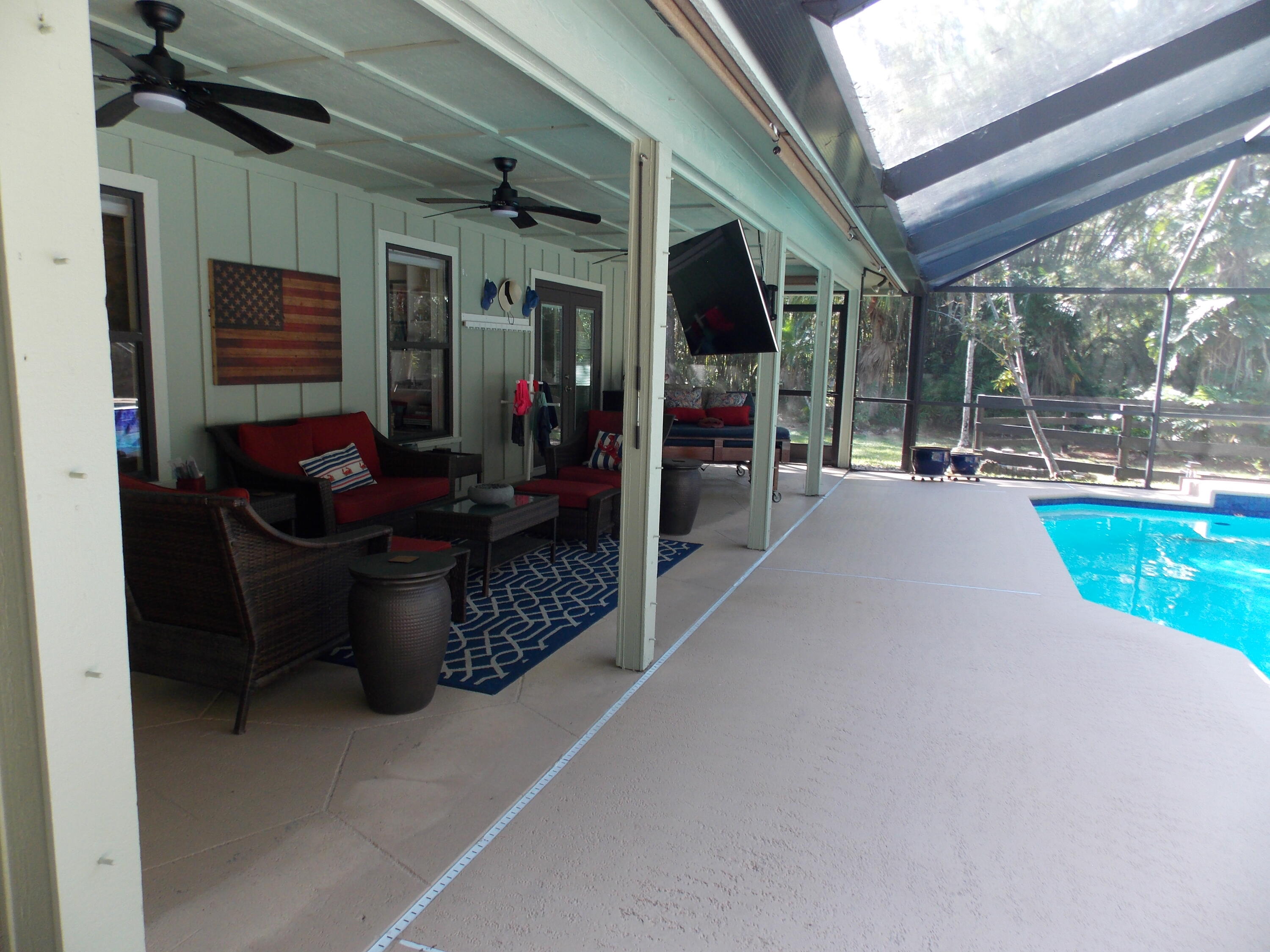 16219 134th Terrace North Jupiter, FL 33478 - Photo 31 of 40 a view of a patio with table and chairs