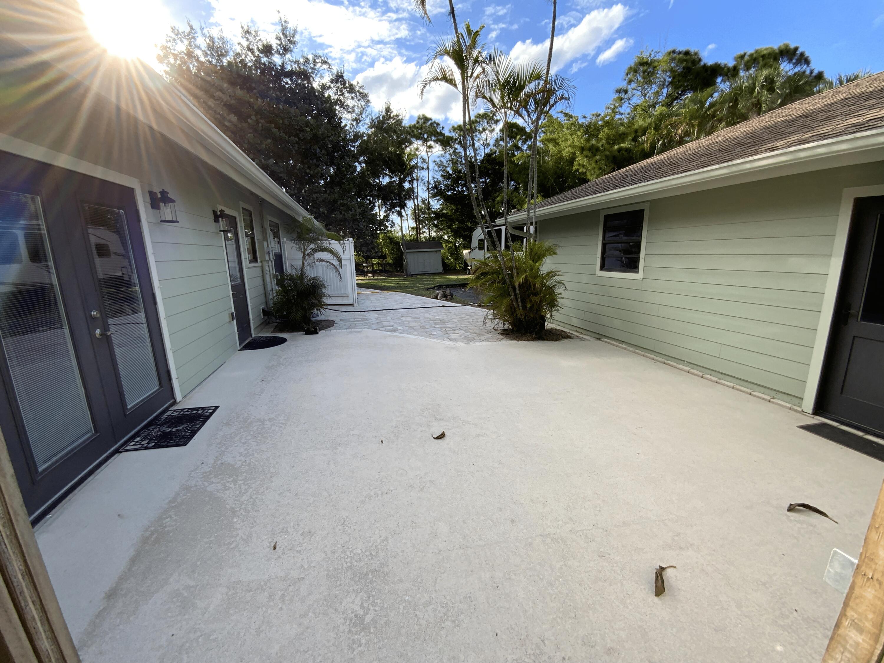 16219 134th Terrace North Jupiter, FL 33478 - Photo 32 of 40 a backyard of a house with lots of green space