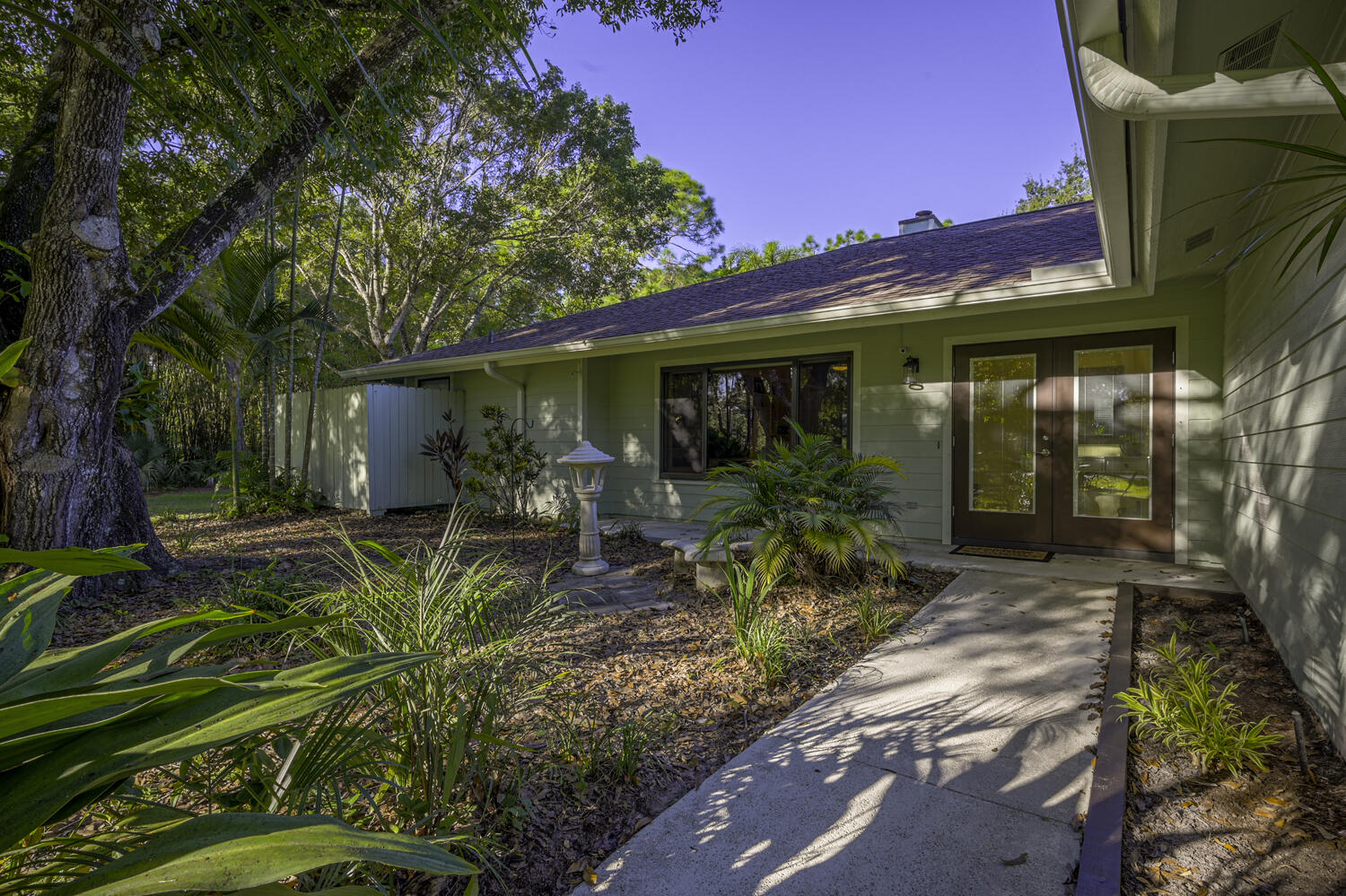 16219 134th Terrace North Jupiter, FL 33478 - Photo 4 of 40 a view of a house with fountain in front of it