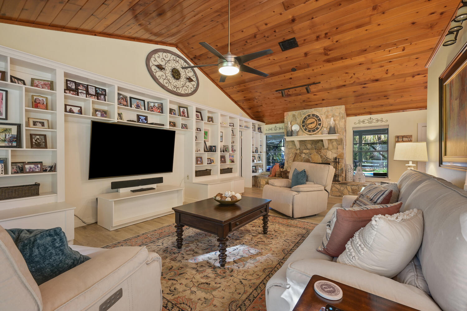 16219 134th Terrace North Jupiter, FL 33478 - Photo 6 of 40 a living room with furniture and a flat screen tv