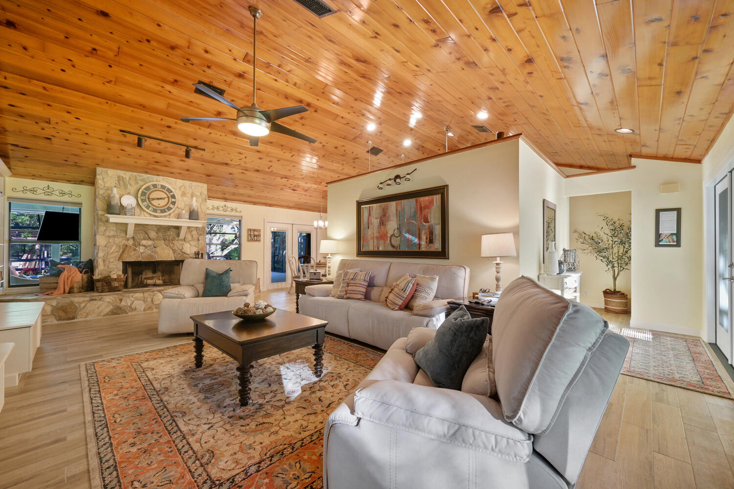 16219 134th Terrace North Jupiter, FL 33478 - Photo 7 of 40 a living room with furniture and a wooden floor