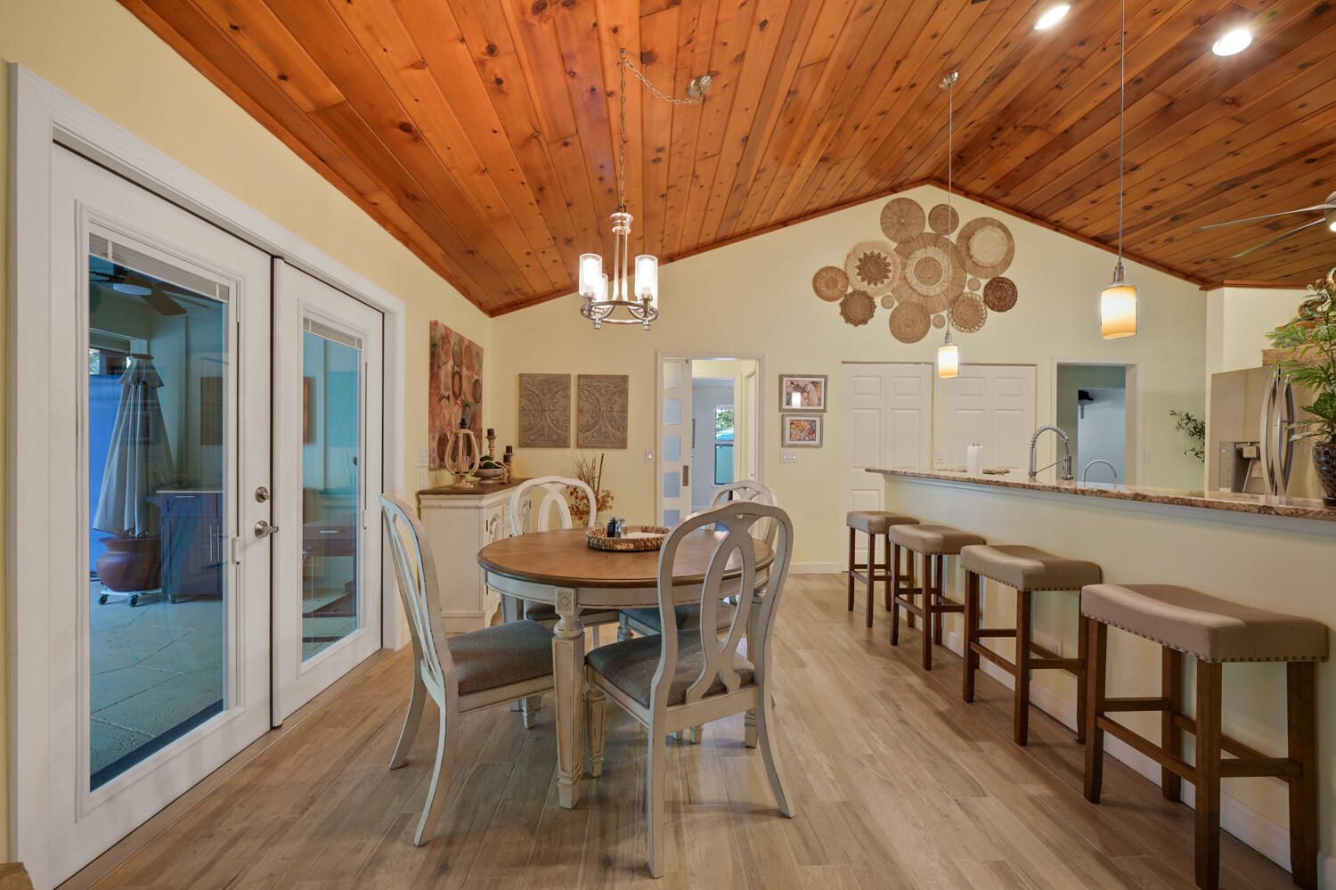 16219 134th Terrace North Jupiter, FL 33478 - Photo 9 of 40 a view of a dining room with furniture and a chandelier