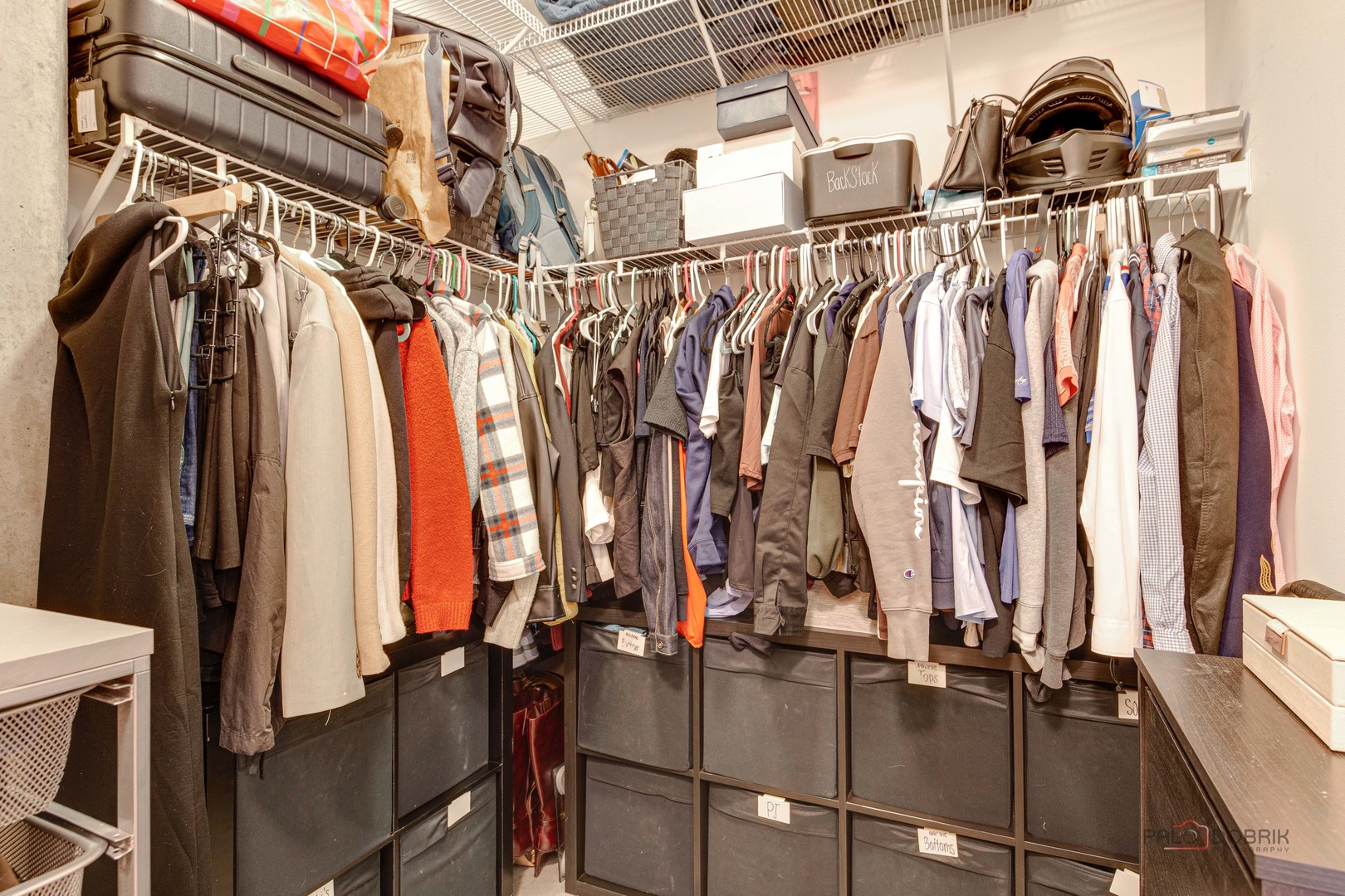 700 West Van Buren Street, Unit 1402 Chicago, IL 60607 - Photo 13 of 15 a view of walk in closet with clothes and shoes