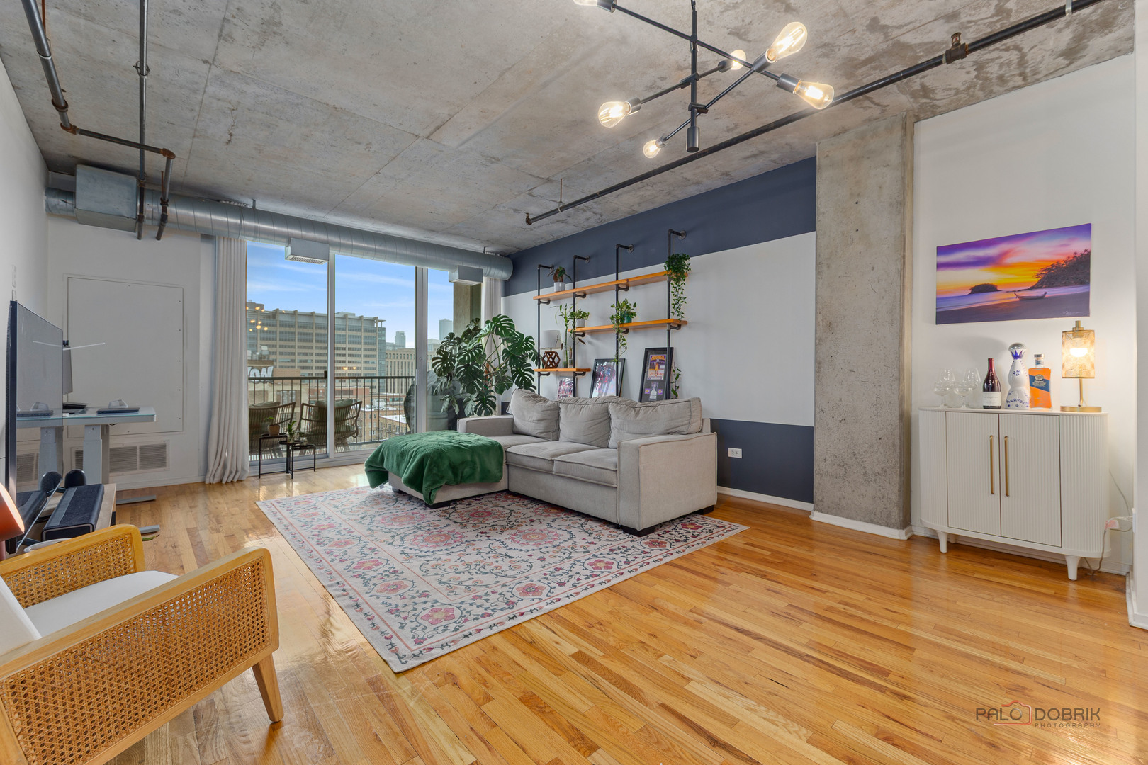 700 West Van Buren Street, Unit 1402 Chicago, IL 60607 - Photo 4 of 15 a living room with furniture and a large window