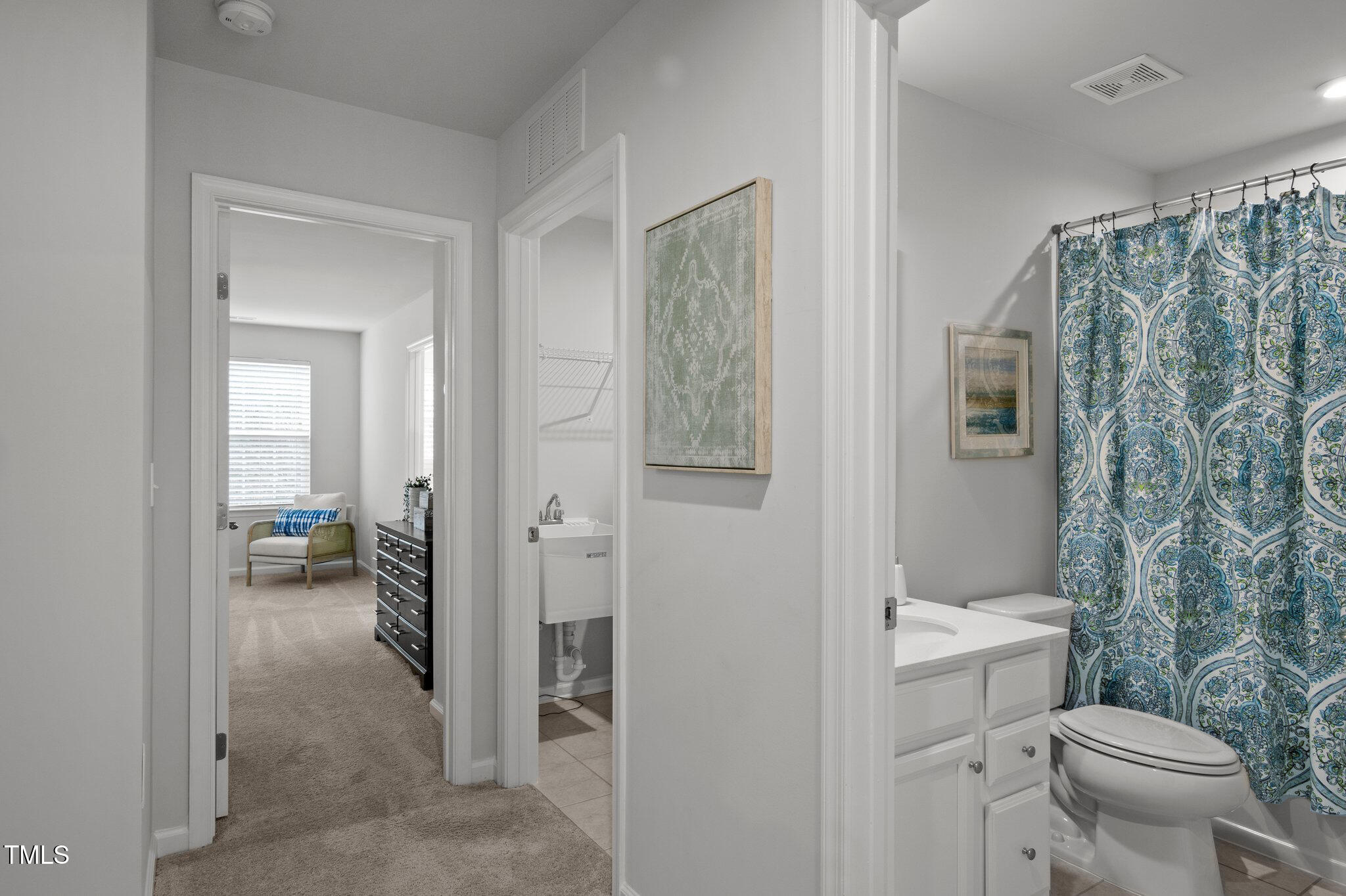 4742 Randall Road Durham, NC 27707 - Photo 20 of 40 a bathroom with a toilet sink and shower