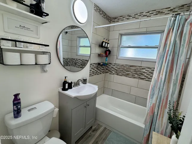 a bathroom with a toilet and a sink