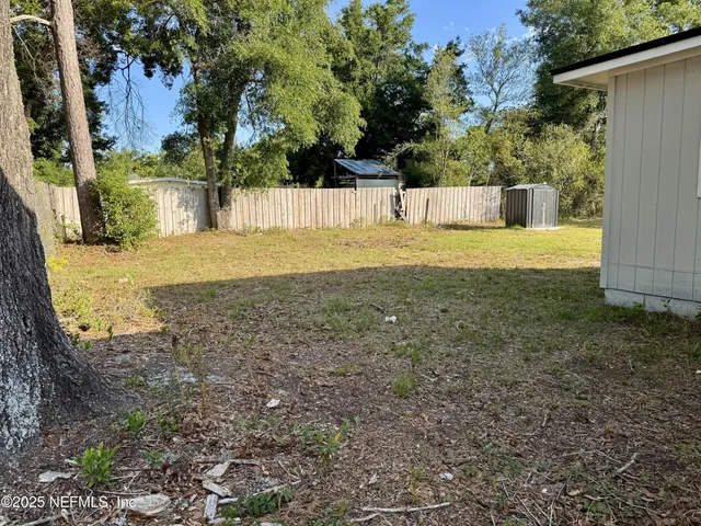 a view of a house with basketball court