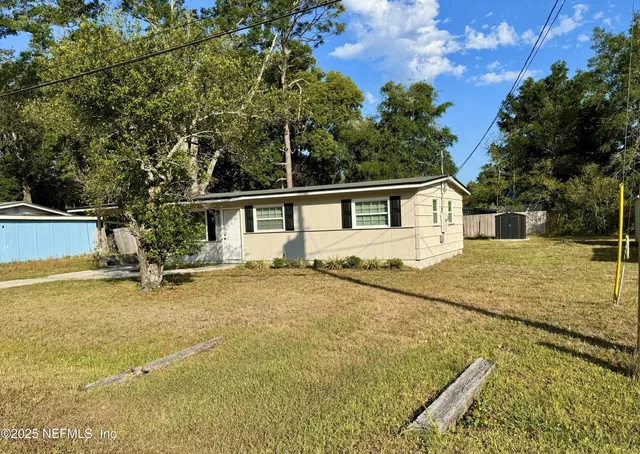 a backyard of a house with lots of green space