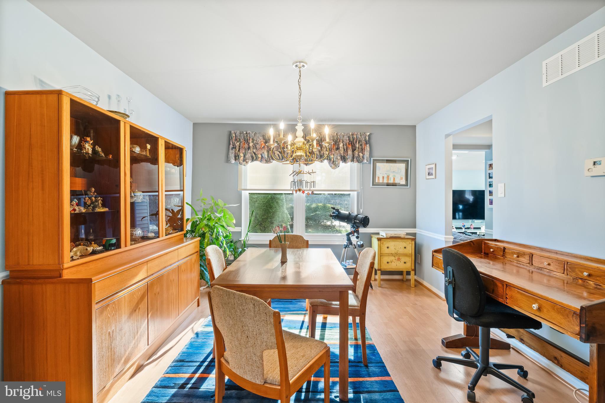 29 Tree Bark Lane Southampton, PA 18966 - Photo 30 of 50 a dining room with furniture a chandelier and wooden floor