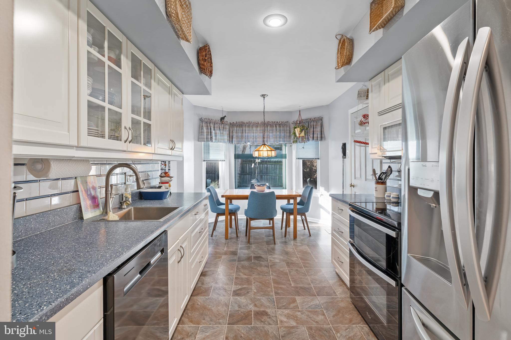 29 Tree Bark Lane Southampton, PA 18966 - Photo 37 of 50 a kitchen with stainless steel appliances granite countertop a refrigerator and a sink