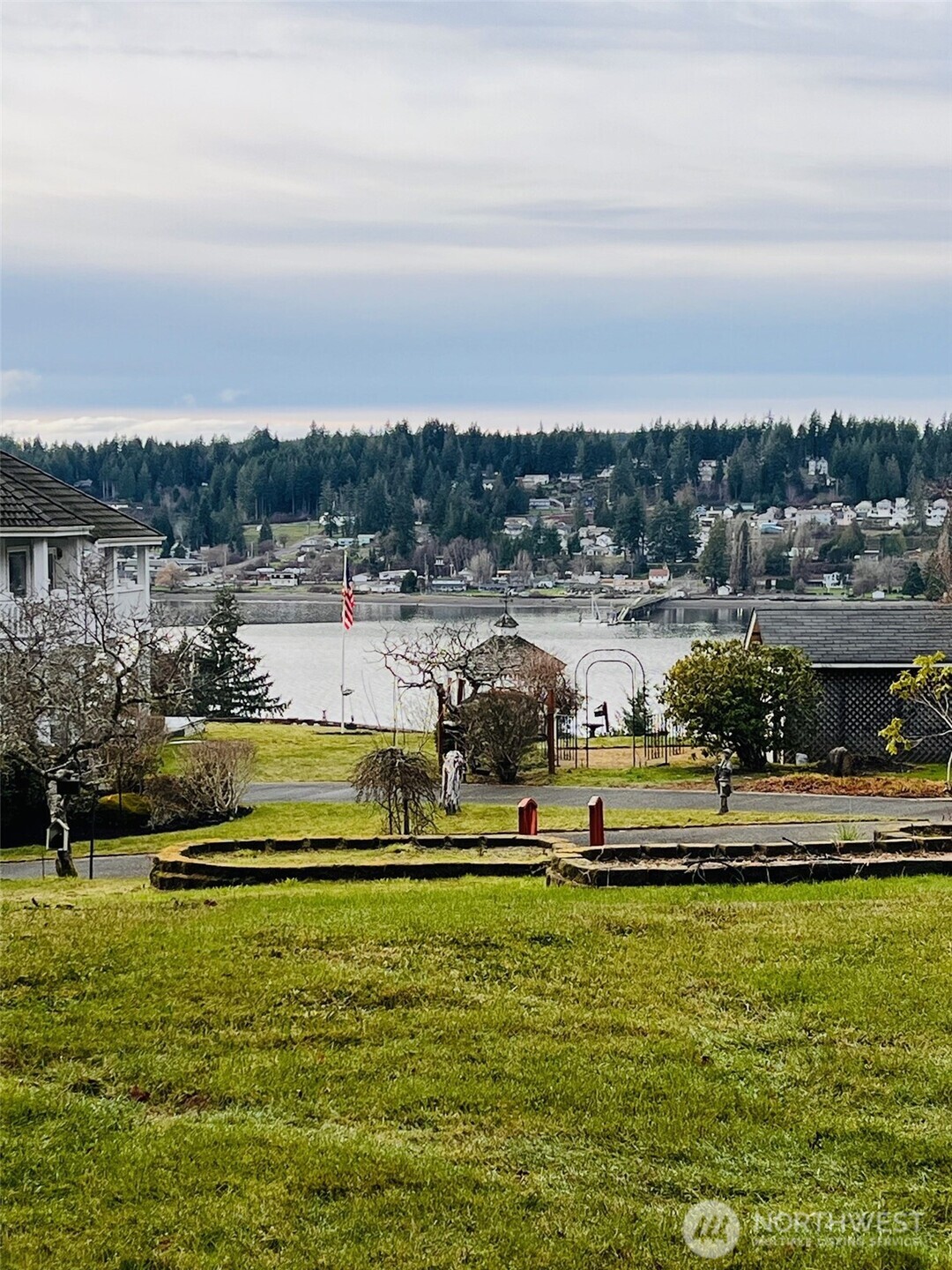 a view of a lake with houses in the back