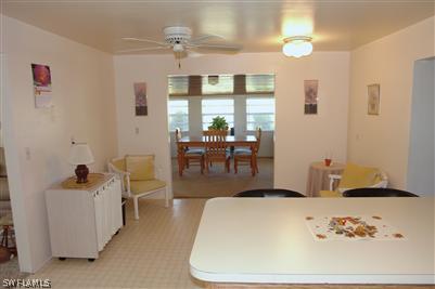 5808 Sailfish Road Bokeelia, FL 33922 - Photo 7 of 9 a living room with furniture and a large window