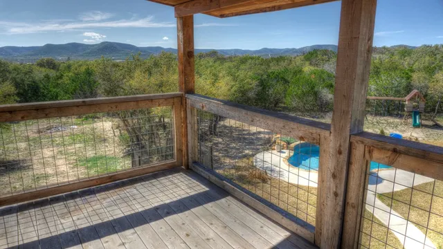 a view of a swimming pool with a yard