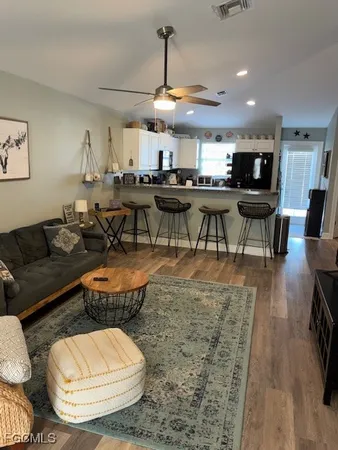 a view of a dining room with furniture and wooden floor