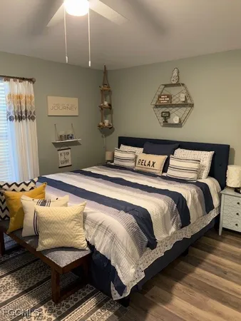 a bedroom with a bed and chair