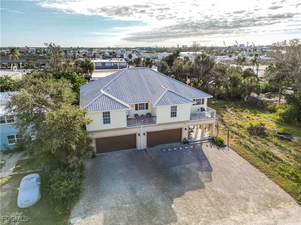 a aerial view of a house with a yard