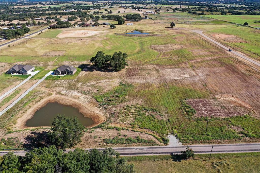 2160 County Road 4371 Decatur, TX 76234 - Photo 12 of 31 a view of a swimming pool with a yard