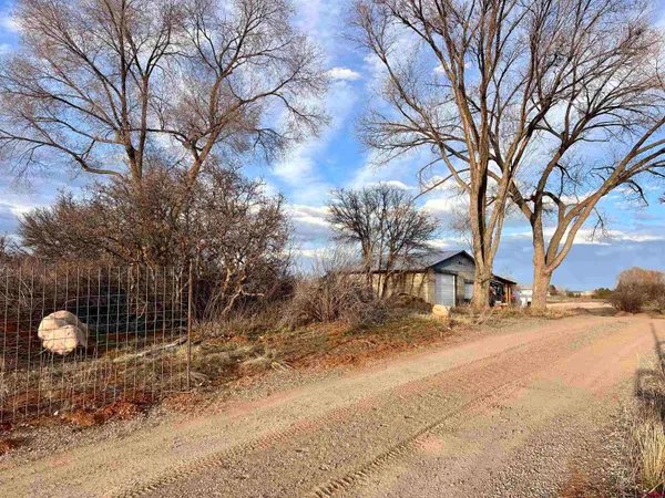 a view of lake with sunset in background