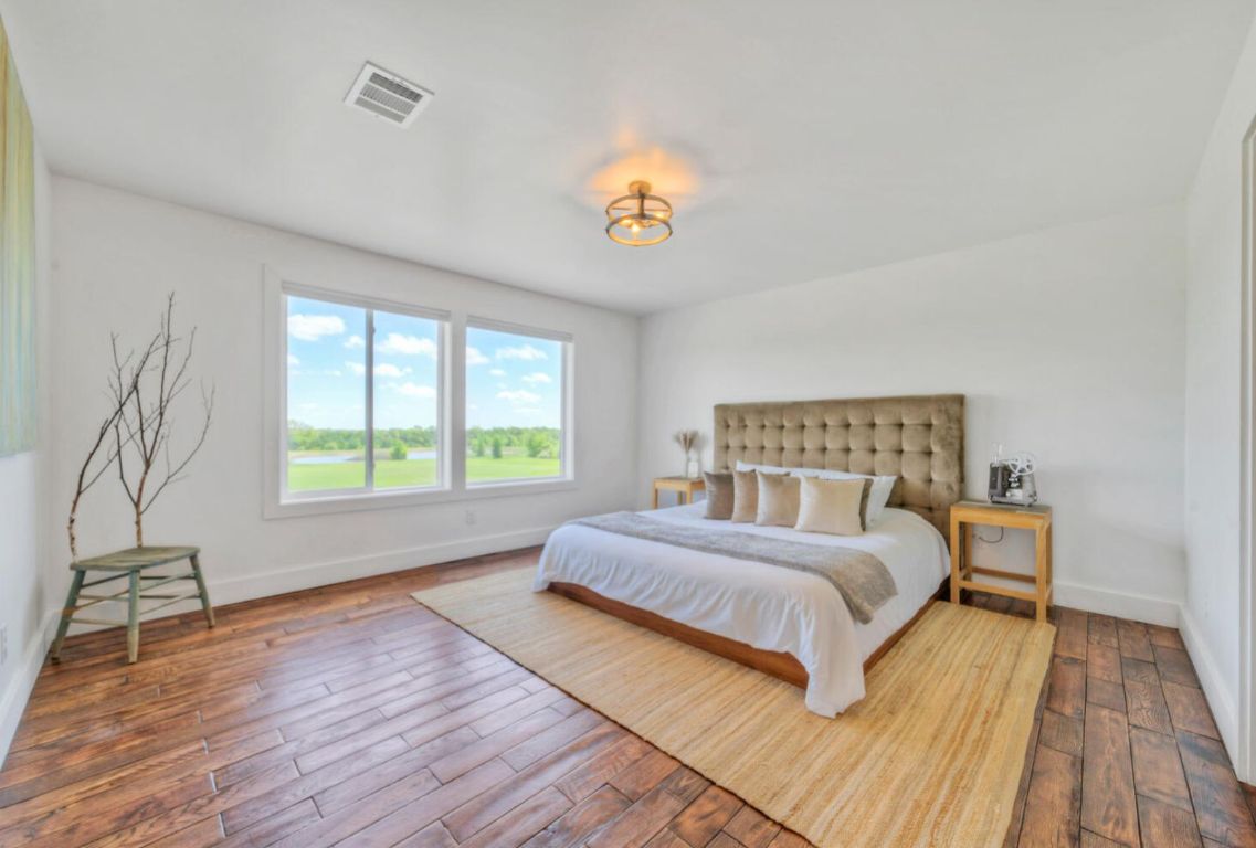0 County Road 463 Elgin, TX 78621 - Photo 17 of 37 a spacious bedroom with a bed and a window