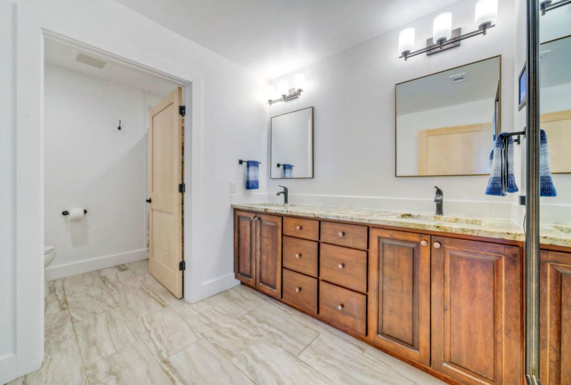 0 County Road 463 Elgin, TX 78621 - Photo 18 of 37 a spacious bathroom with double vanity sink a mirror and a shower