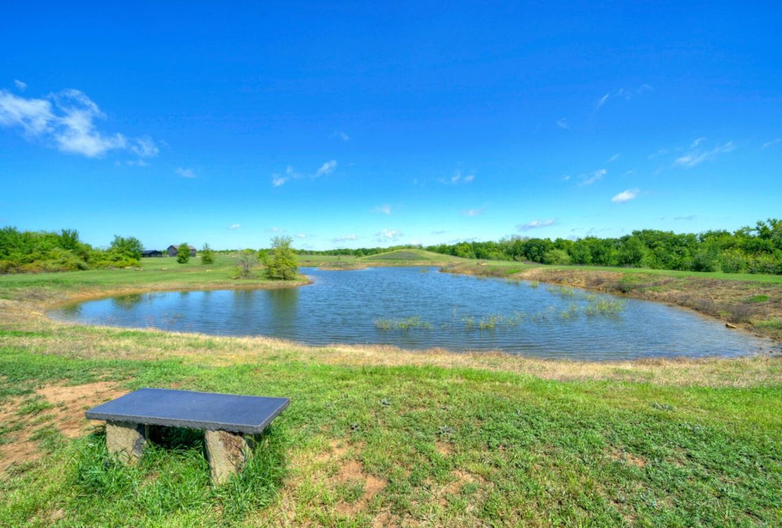 0 County Road 463 Elgin, TX 78621 - Photo 28 of 37 a view of a lake with houses in the back