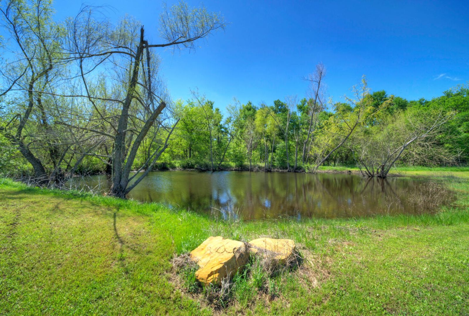 0 County Road 463 Elgin, TX 78621 - Photo 33 of 37 a backyard of a house with lots of green space and lake view